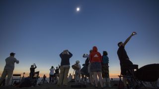 Locals and travelers from around the world gather on Menan Butte to watch the eclipse on August 21, 2017 in Menan, Idaho. Millions of people have flocked to areas of the U.S. that are in the "path of totality" in order to experience a total solar eclipse.