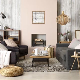 pink and neutral living room with sofa cushions coffee table and sakka rug