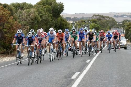 The leading bunch battle the wind but were way in front to worry