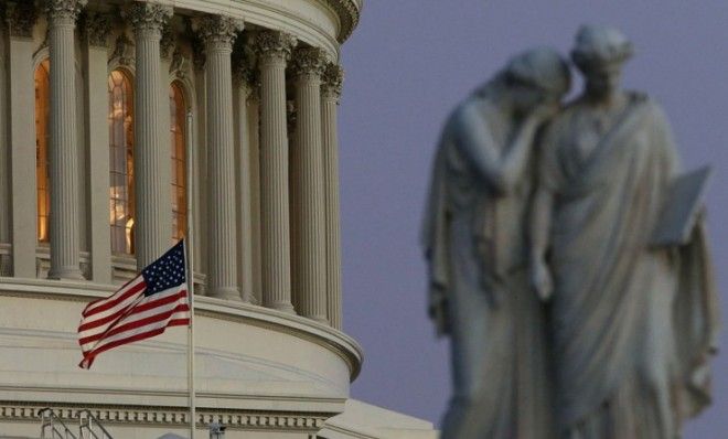 A flag flies at half-staff at the U.S. Capitol after the shootings at the Sandy Hook Elementary School, on Dec. 14.