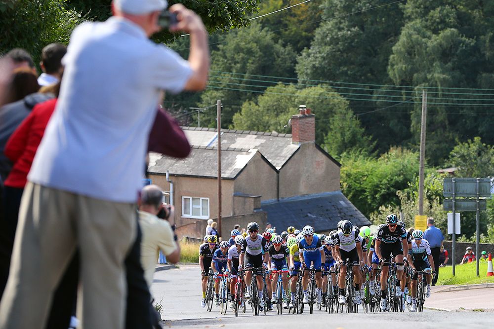 Fans snap photos at the peloton approaches