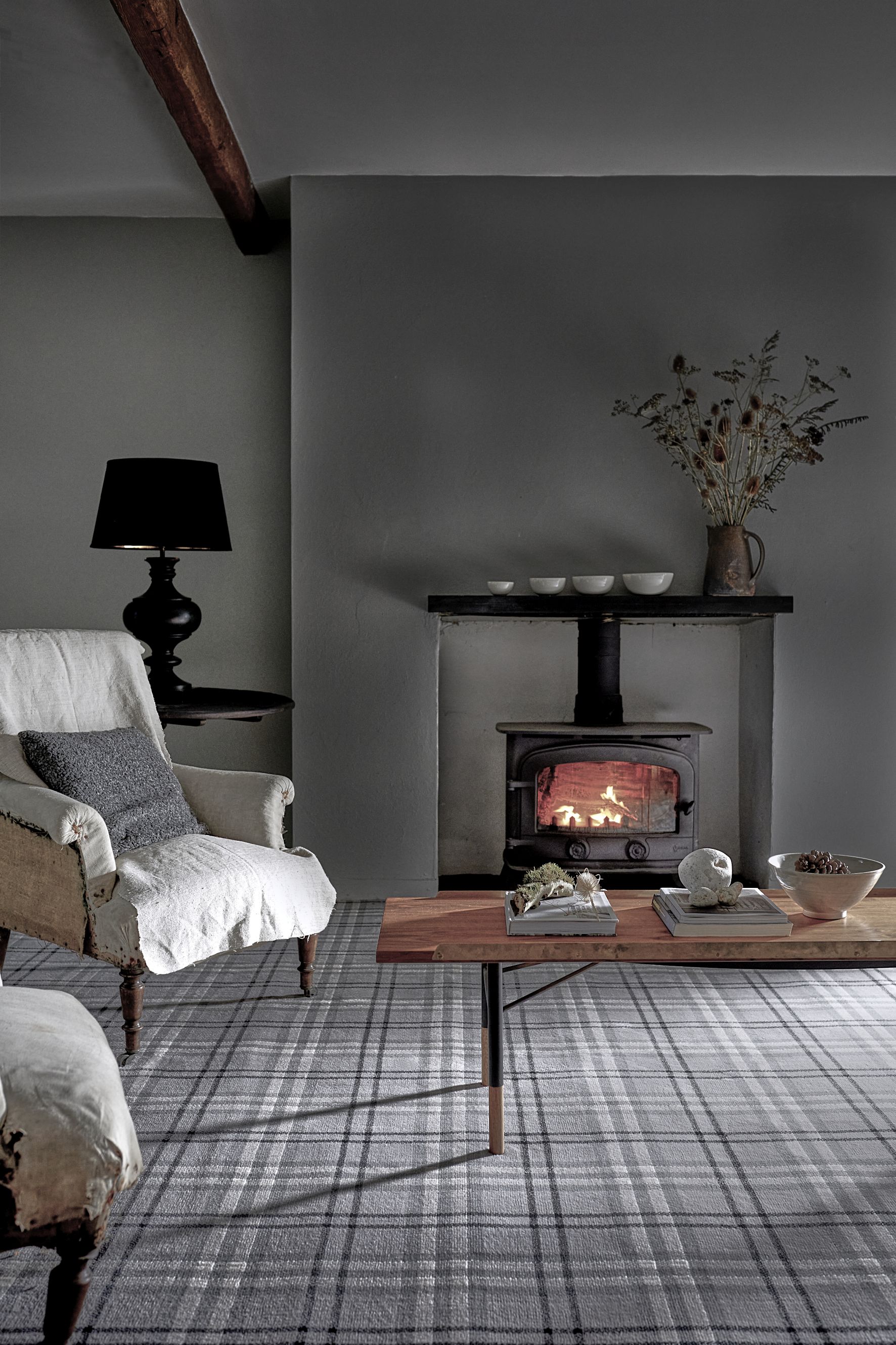 a Carpetright a/w gray living room with dark and wooden accessories