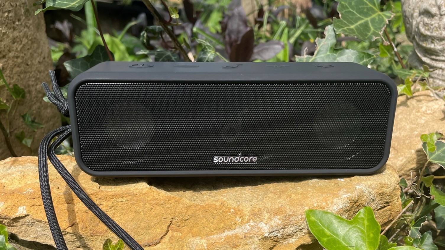 Anker Soundcore 3 speaker on garden wall
