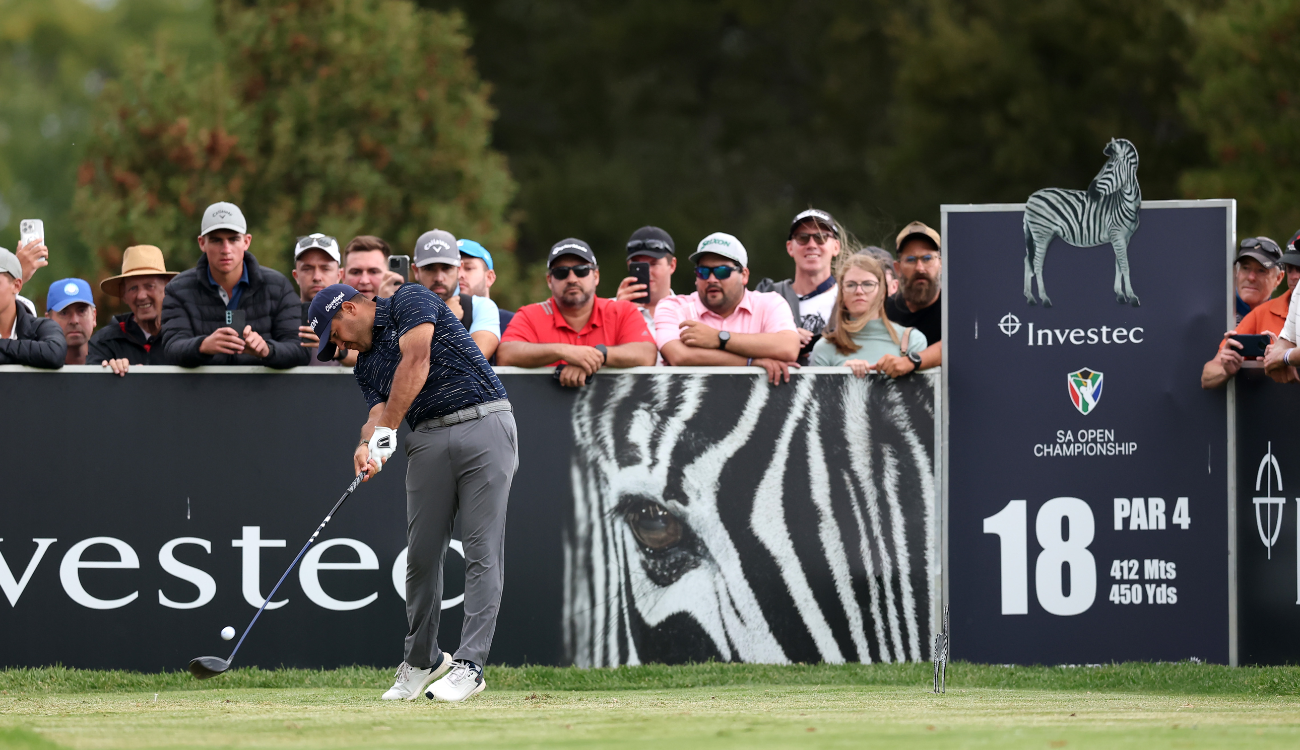 Hennie Du Plessis hits a tee shot