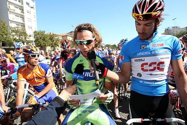 Cancellara assists Pippo to read a statement about the inhumane treatment of Kevin Van Impe, who was subjected to a doping control while making arrangements for the funeral of his infant son.