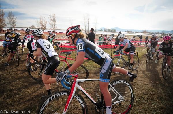 Riders dismount en masse as they approach the barriers