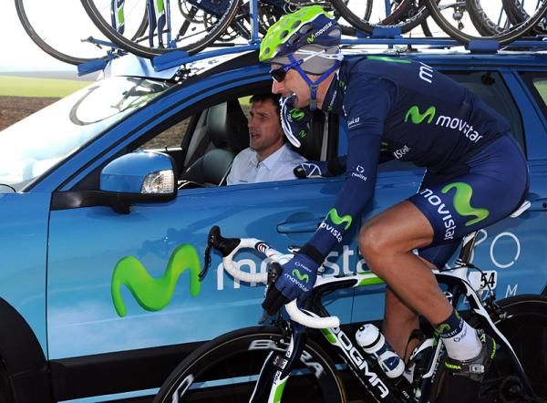 David Lopez Garcia (Movistar) gets some attention from the team car