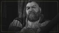 Black-and-white screenshot from The Witcher 3 of Zoltan Chivay with his arms crossed. The dwarf character has a big bushy beard and small spiky mohawk. The edge of the image is outlined by a thin gold frame.