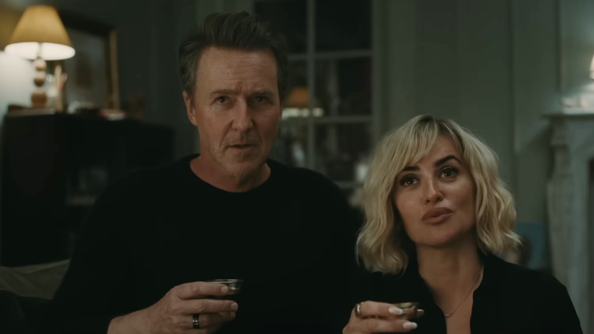 Edward Norton and Penelope Cruz with a drink in The Invite.