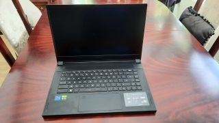 A full body picture of the MSI Stealth GS66 12UGS gaming laptop on a table