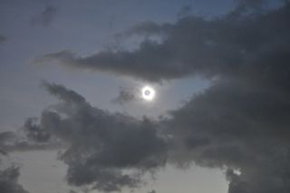 Light Halo Visible as Clouds Surround Total Solar Eclipse