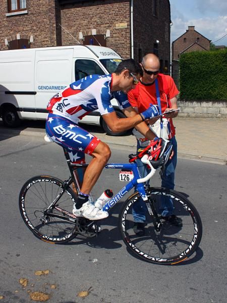 Hincapie even stopped on the way to the start line to sign a fan's autograph.