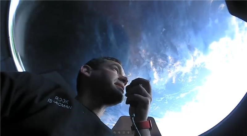 Inspiration4 commander and tech billionaire Jared Isaacman looks out the cupola window on SpaceX&#039;s Crew Dragon Resilience on Thursday, Sept. 16, 2021.