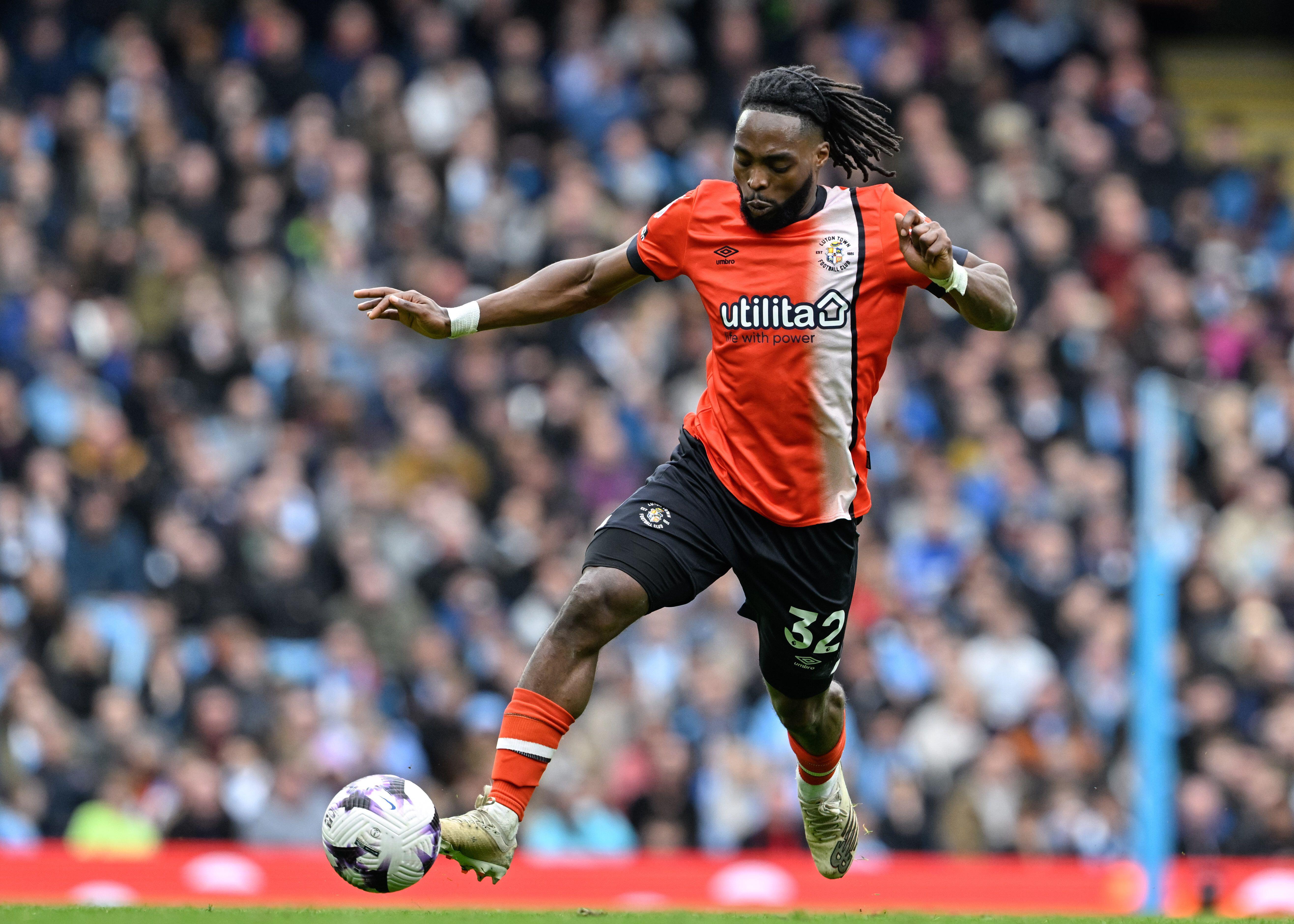 Fred Onyedinma in action for Luton Town against Manchester City in the Premier League on April 13, 2024