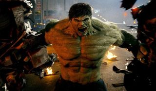The Incredible Hulk holds two halves of a car in Harlem