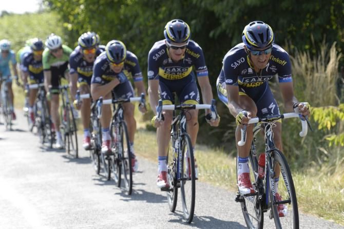 In a show of force Team Saxo-Tinkoff forced a separation in the latter portion of stage 13, enabling Alberto Contador to make up time on Tour leader Chris Froome