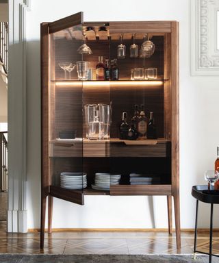 How to style a display cabinet - wooden glass fronted dresser or drinks cabinet in dining room setting with LED lights
