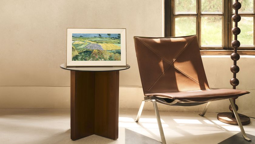 Pexar Starlight digital photo frame on a stand in an arty front room