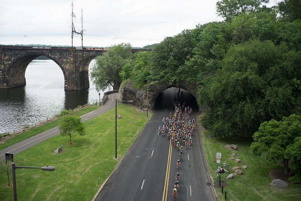 The peloton rides alongside the Schuylkill River during the Philadelphia International Cycling Classic.