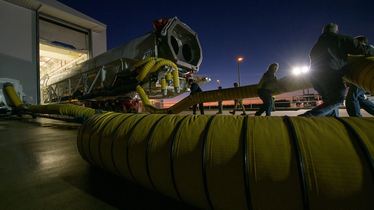 A Northrop Grumman Antares rocket is seen as it is rolled out of the Horizontal Integration Facility to launch Pad-0A, Tuesday, Oct. 29, 2019, at NASA's Wallops Flight Facility in Virginia.