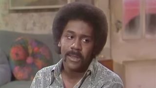 Lamont Sanford (Demond Wilson) talks to his father on Sanford and Son.