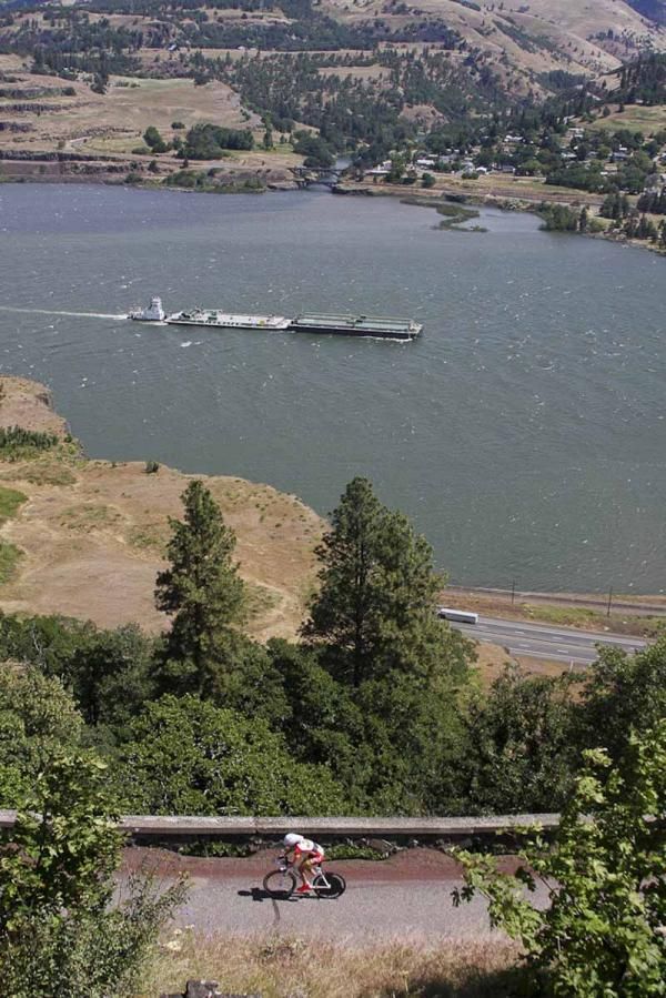 Columbia River barge traffic shadows riders below the Scenic Gorge Time Trial course