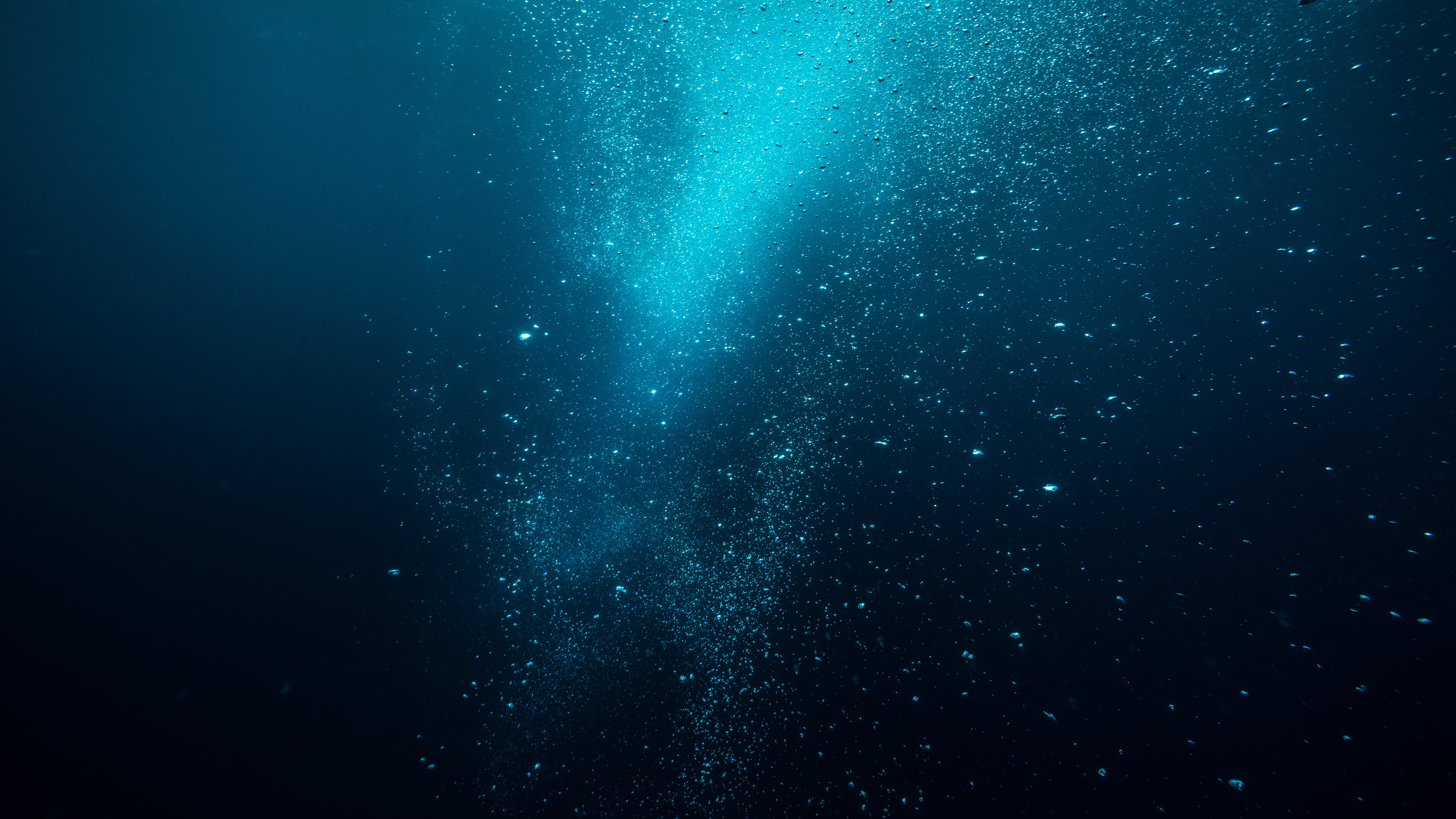 plume of bubbles deep underwater