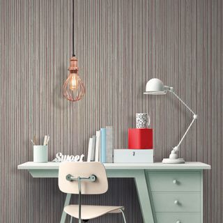 home office with stripe wallpaper and pendant light