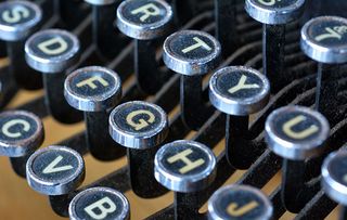 old fashioned typewriter keyboard with QWERTY layout