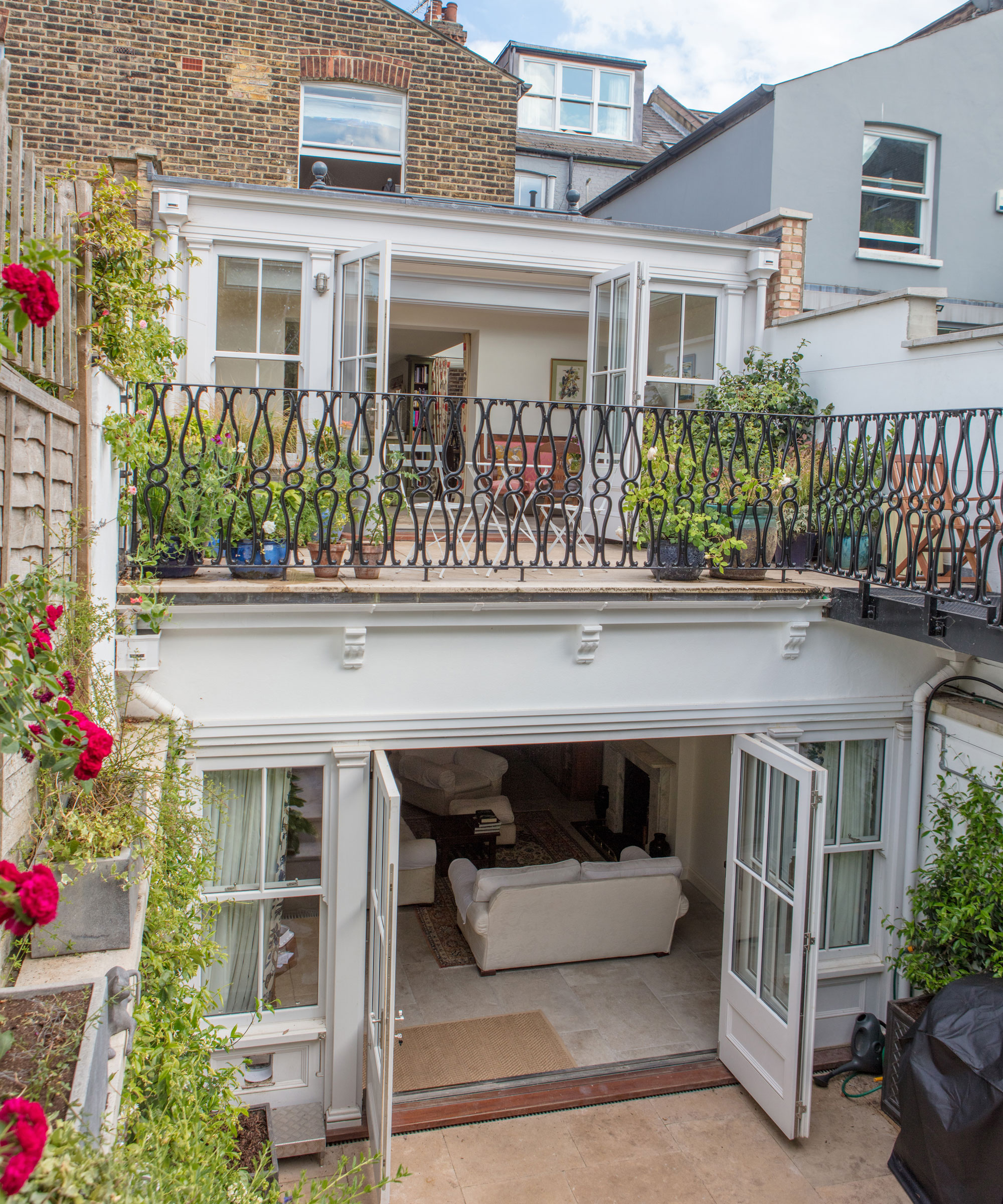 two-storey orangery with French doors and balcony