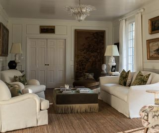 white traditional living room with green fall accents