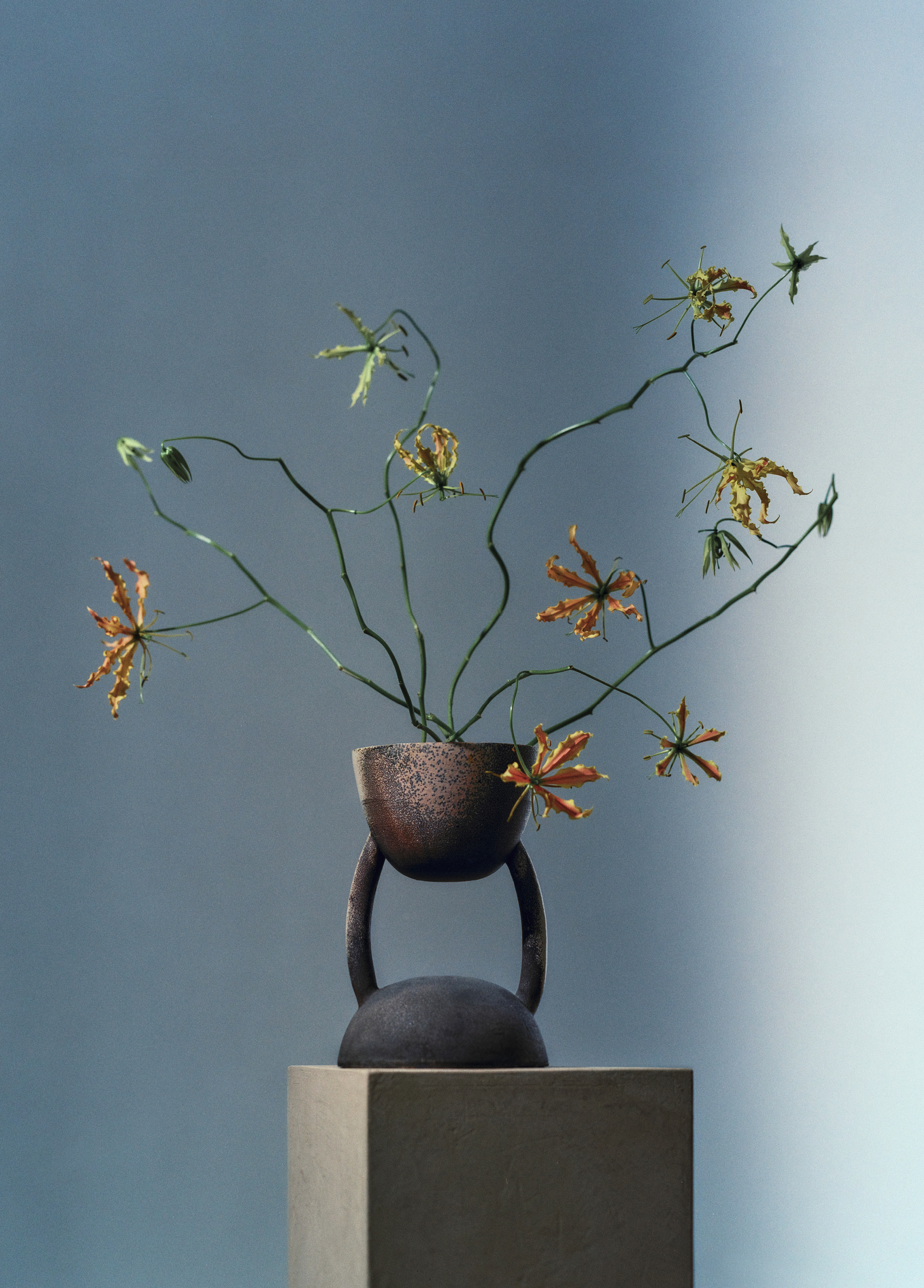 Vase with yellow and orange flowers
