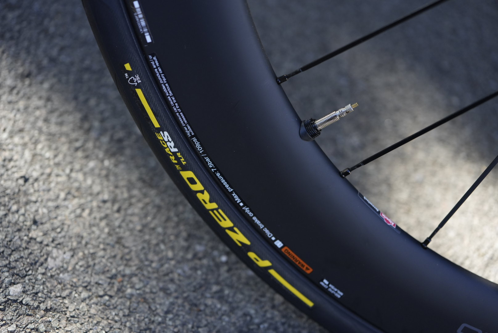 Pirelli tyre mounted to unreleased C60 carbon wheel, showing new carbon spokes