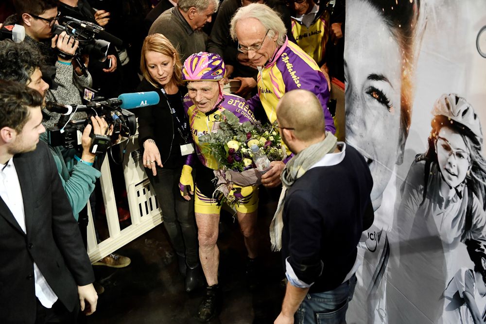 French centenarian cyclist Robert Marchand reacts after setting a one-hour track cycling World record at 22.547km in the over-105 age group