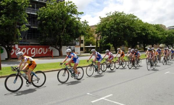The women's peloton gets strung out during the race.