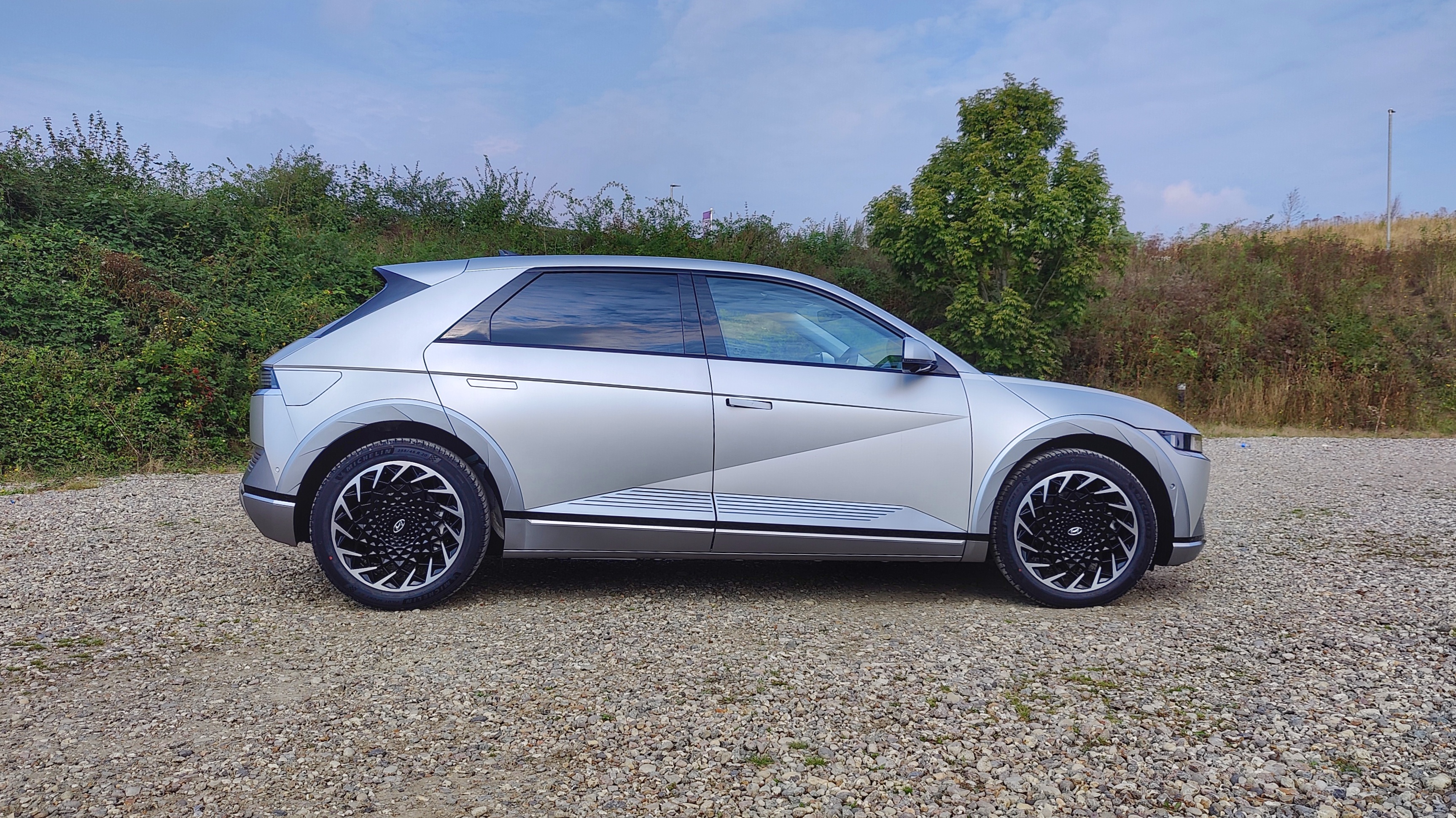 Side view of Ioniq in gravel parking lot