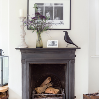 Vintage old fireplace, country themed, rustic feel, home owned by Rosie Simmons