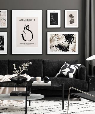 monochrome artwork arranged on the wall of a modern living room