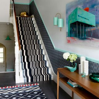 hallway with grey designed and white wall and designed steps