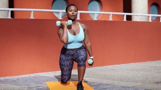 Beginner Strength Training: Woman on mat working out with dumbbells