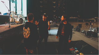 Gojira chatting on stage before the show