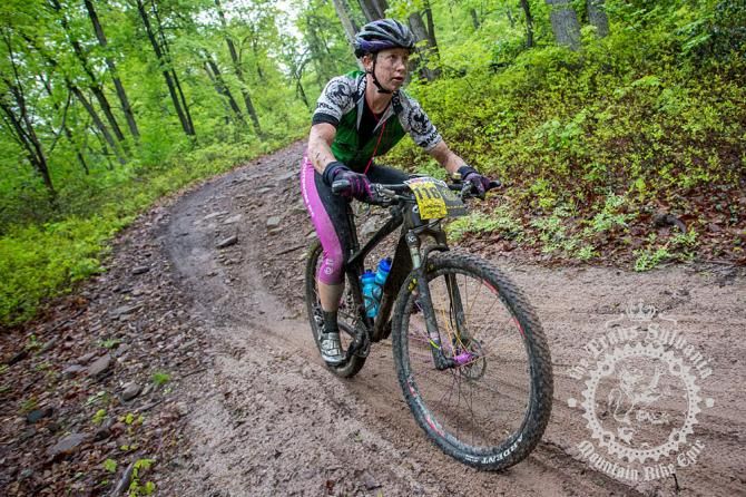 Andrea Wilson pedaling through the sandy descent.