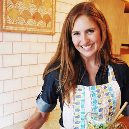 Lady wearing apron in kitchen