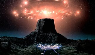Close Encounters of the Third Kind a spaceship over Devil's Tower