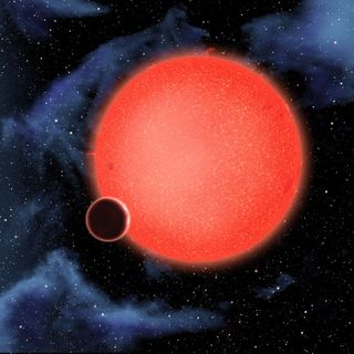 An artist’s impression of the super-earth GJ 1214b orbiting close to its star. Astronomers have studied its atmosphere with both the Hubble and Spitzer space telescopes.