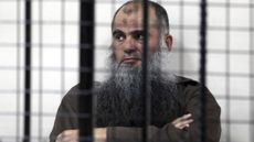 Abu Qatada behind the bars in Amman, Jordan