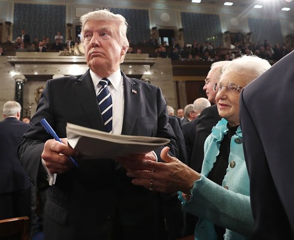 Trump signs an autograph.