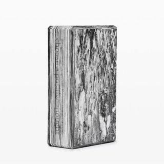 A black and white marble effect yoga block from Lululemon.