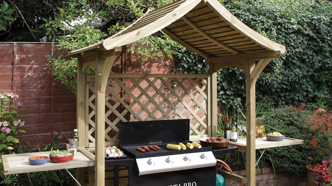 an outdoor grill under a gazebo