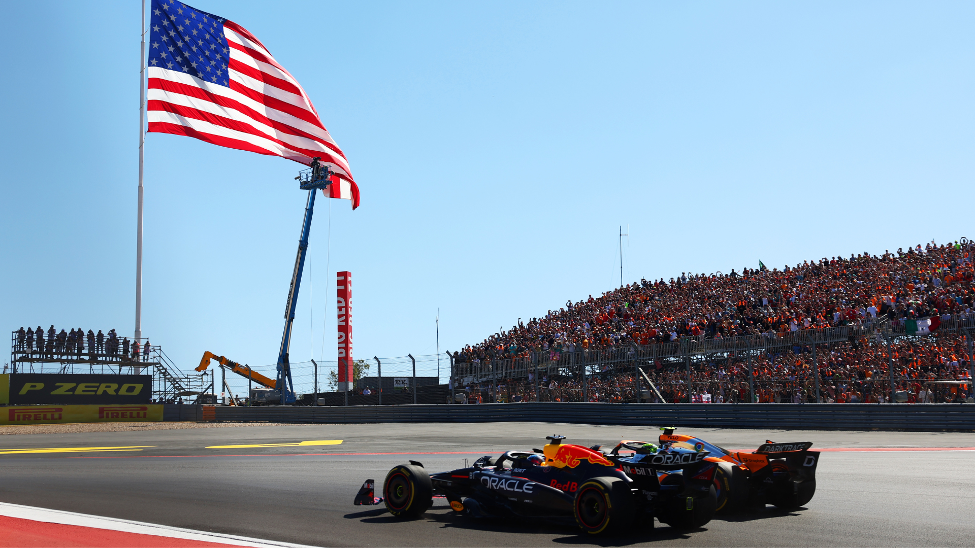 Max Verstappen of the Netherlands driving the (1) Oracle Red Bull Racing RB20 leads Lando Norris of Great Britain driving the (4) McLaren MCL38 Mercedes into turn one at the start during the F1 Grand Prix of United States at Circuit of The Americas on October 20, 2024 in Austin, Texas.